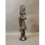 A West African carved wood fertility figure, possibly Bambara tribe, late C19th/early C20th, 28"