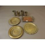 Two Middle Eastern brass wall plaques with Islamic calligraphy and designs, a shaped dish with