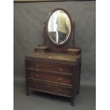 A 1930s oak dressing table with three drawers and mirrored upper section, 39" x 20" x 63"