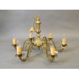 A six branch brass chandelier with pierced scrolled arms, 26" diameter