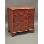 A Georgian style elm veneered serpentine fronted chest of two over three drawers, raised on