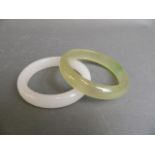 A Chinese white jade bangle, and another similar, 3" diameter