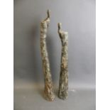 A pair of studio pottery candlesticks in the form of stylised figures, largest 22" (1 AF, repair)