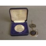 A St Paul's 'Sir Christopher Wren' commemorative coin, together with two replica bronze Greek coins,