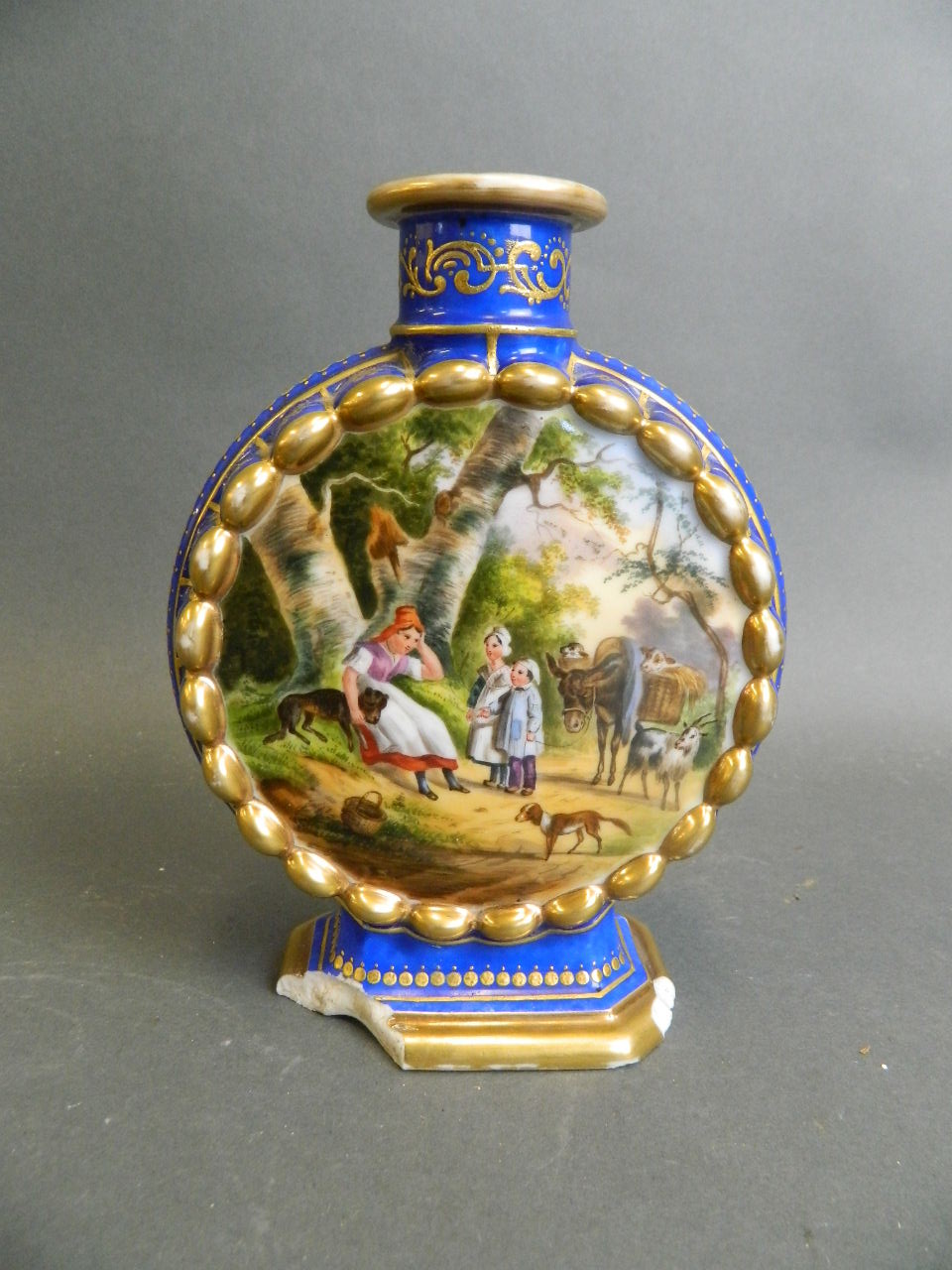 A Continental porcelain blue ground flask with painted decoration of figures and animals in farmyard