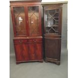 A Georgian style inlaid mahogany bookcase with astragal glazed top and two drawers over two