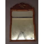 A late C19th walnut Georgian style wall mirror with Ho-Ho bird and parcel gilt decoration, 28" high