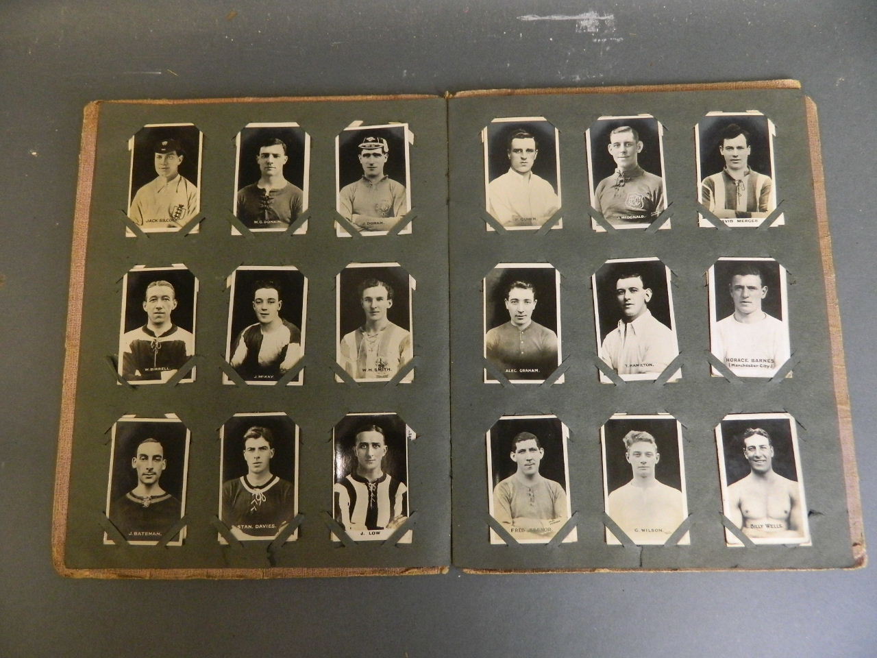 A 1920s 'Adventure & Rover' picture album containing photographic cards of football and boxing