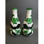 A pair of Peking glass double gourd shaped vases with overlaid decoration of fruiting peach tree