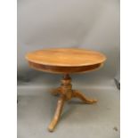 A Continental fruitwood circular top table on a tripod pedestal base, 30" x 36"