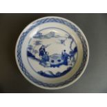 A Chinese blue and white porcelain dish decorated with gentlemen playing chequers, 6 character