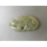 A Chinese celadon jade ornament with carved Mandarin duck decoration, 4" long