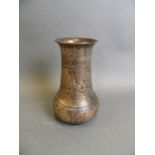 A Mughal bronze vase with traces of enamel and stylised chased lotus flower and palmette decoration,