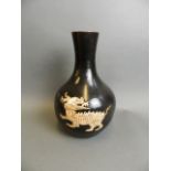 A Chinese black ground bulbous base pottery vase with incised kylin decoration, 12" high