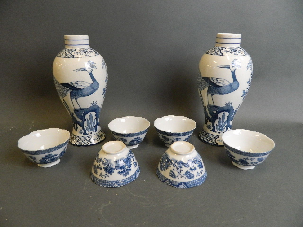 A pair of English blue and white porcelain jars decorated with Asiatic pheasants, together with