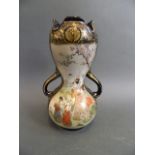 A Japanese Satsuma porcelain double gourd shaped twin handled vase decorated with figures and