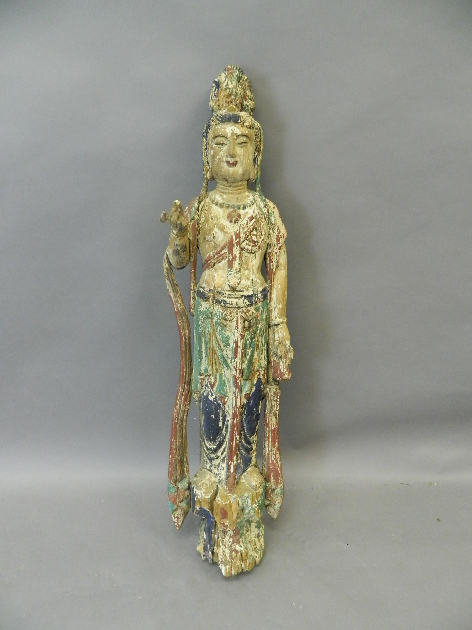 A Chinese carved and polychrome wood figure of Quan Yin, 38" high