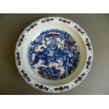 A Chinese blue and white porcelain dish with lobed edge, painted decoration of a lady on horseback