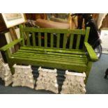 A weathered teak garden bench, 51" long