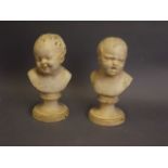 A pair of cold painted bronze busts of young children, 8" high