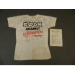 An original 'Rock Against Repatriation' t-shirt, signed by all the artists who participated,