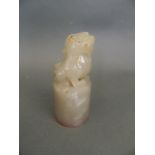 A Chinese grey jade cylinder seal with carved kylin knop, 4" high