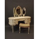 A Louis XV style painted kidney shaped five drawer dressing table with triptych mirror and stool,