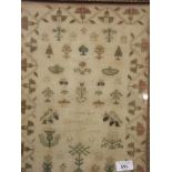 A mid C19th sampler with butterflies and birds within a stylised floral border, 'done by Agness