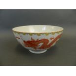 A Chinese polychrome enamel porcelain bowl with twin red dragon and flaming pearl decoration, seal