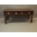 A C19th Anglo-Indian hardwood two drawer side table with brass handles, raised on carved twisted