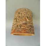 A Chinese bamboo brush pot with carved decoration of immortals and their acolytes, 6" high