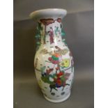 A large Chinese porcelain vase decorated in bright enamels with a figure riding a kylin and many