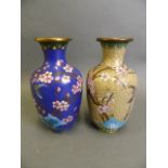 A Chinese blue ground cloisonné vase with butterfly and prunus decoration, and another with a yellow