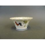 A Chinese Doucai enamelled porcelain tea bowl with pie crust rim and poultry decoration, 6 character