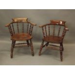 A near pair of C19th smoker's bow elbow chair with shaped elm seats