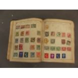 An album containing world stamps from the late C19th and early C20th