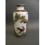 A Chinese Republic porcelain cylindrical vase decorated in bright enamels with a child riding a