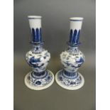 A pair of Chinese blue and white porcelain vases of unusual form decorated with a dragon chasing the