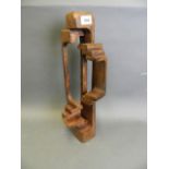 A stained wood abstract sculpture, signed to base in pencil 'Brian Willsher 1976', 18" high