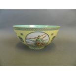 A Chinese famille jaune enamelled porcelain bowl with four decorative panels depicting the Eight