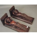 A pair of varnished carved wood brackets in the form of cherubs, 8" x 9" x 23"