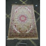 A Kashmir rug with floral medallion design, 62" x 90"