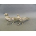 A pair of silvered metal Asiatic pheasants, 11" long