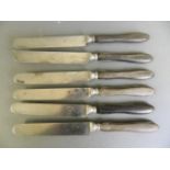 A set of six C19th French table knives with horn handles, 10" long