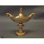 A gilt metal urn shaped lamp with Adam style decoration, 13" high