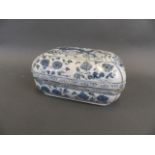 A Chinese blue and white porcelain scribe's box decorated with a dragon amongst water lilies, 6