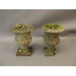 A pair of C19th weathered marble urns, 13" high