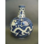 A Chinese blue and white porcelain moon flask with incised dragon decoration, 2 character mark to