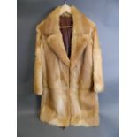 A lady's three-quarter length fur coat