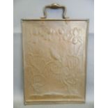 An Arts & Crafts copper screen with embossed decoration of a bird amongst irises, 26" x 17"